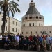The pilgrims pose as a group before the Basilica of the Annunciation in Nazareth